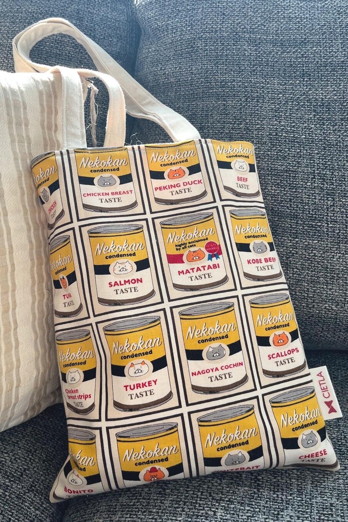 CIETLA Nekokan Cat Condensed Tote Bag (Yellow) on sofa
