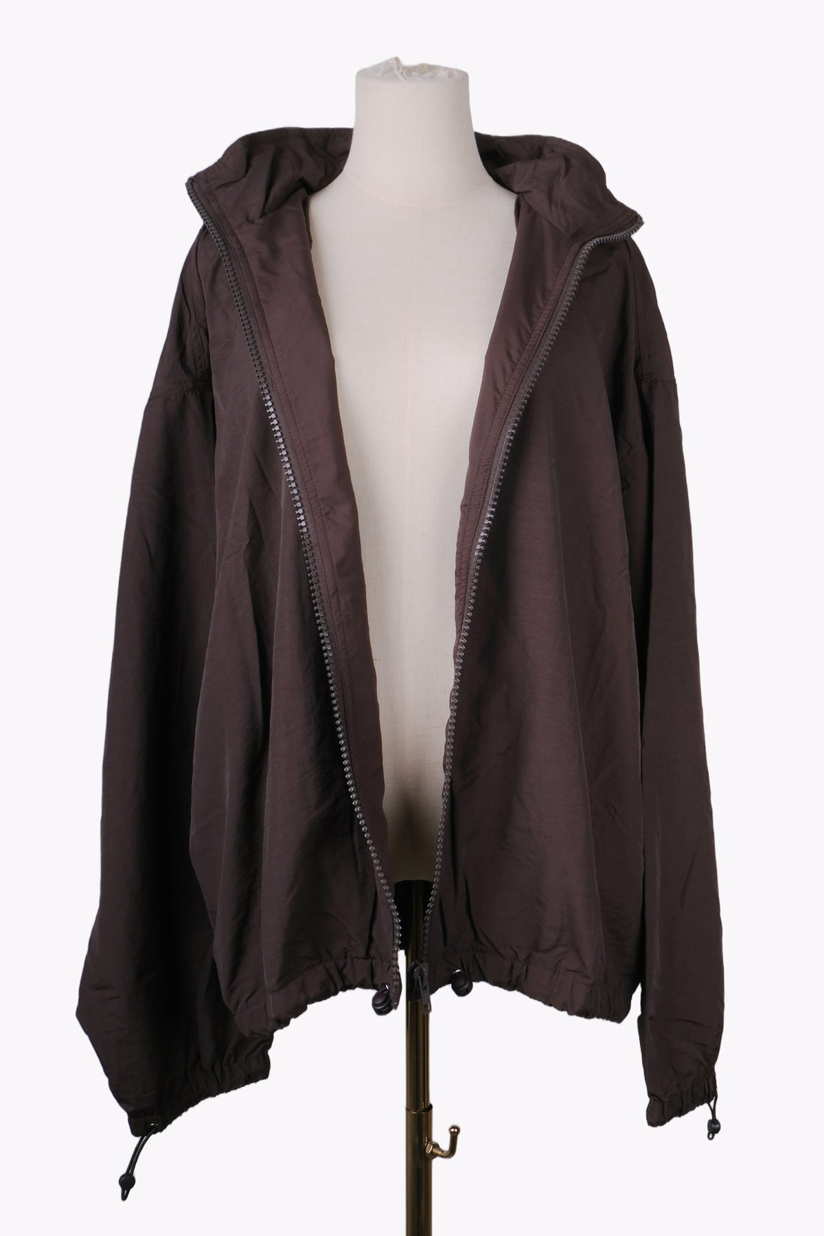 Brown hooded jacket on a mannequin against a white background