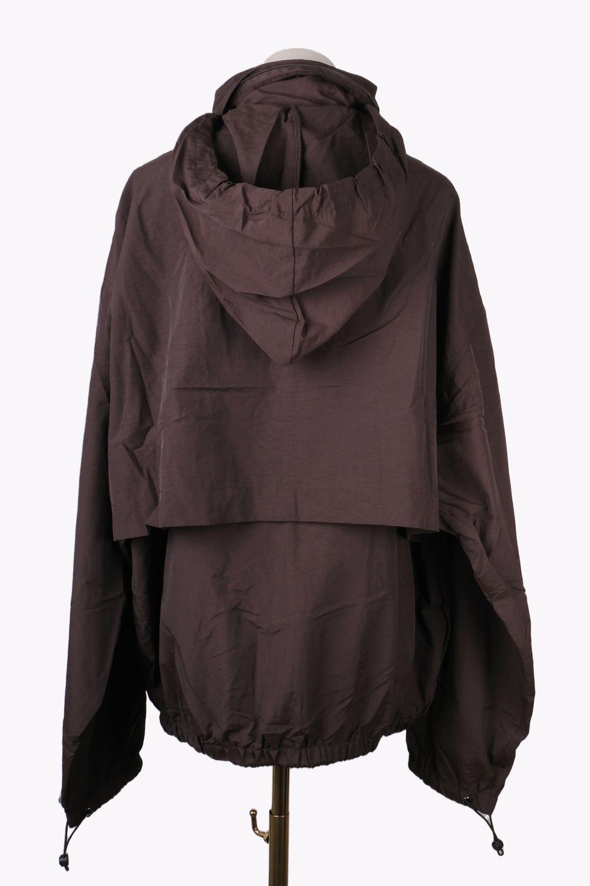 Brown hooded jacket on a mannequin against a white background