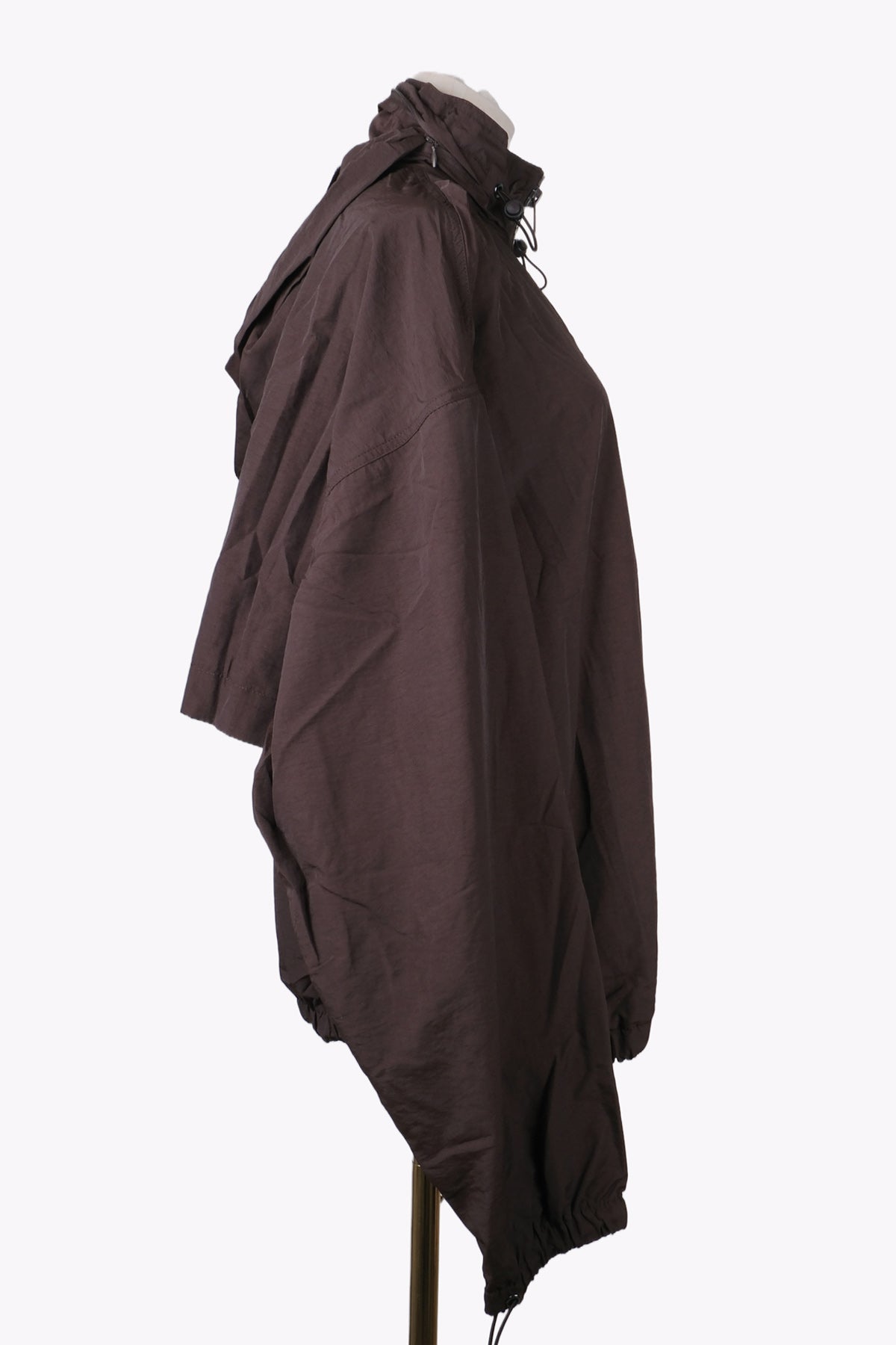 Brown jacket on a mannequin against a white background