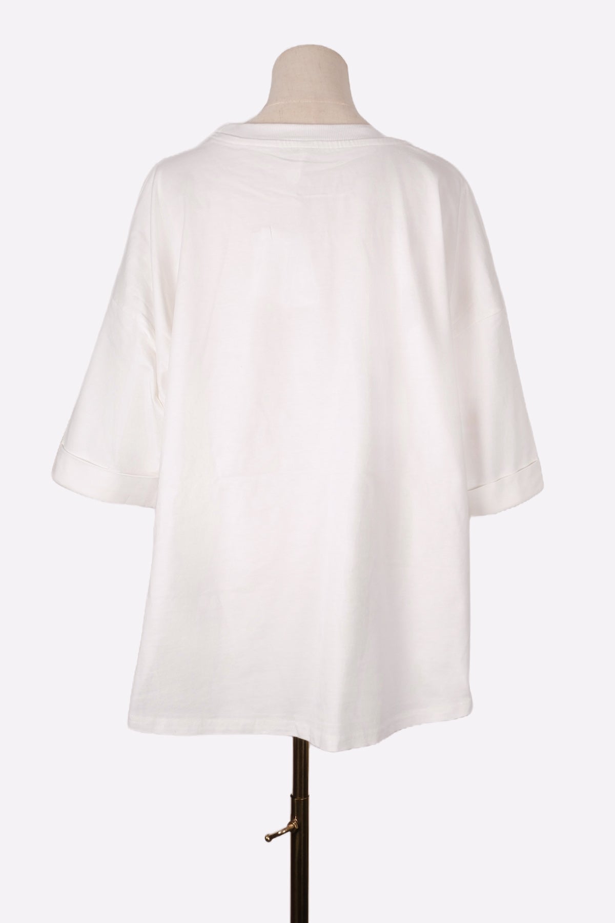 White Tee on a mannequin against a white background